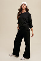 Women's black lounge set featuring a cropped pullover and wide-leg pants, perfect for casual wear, cozy loungewear, and trendy athleisure outfits for teens and young women